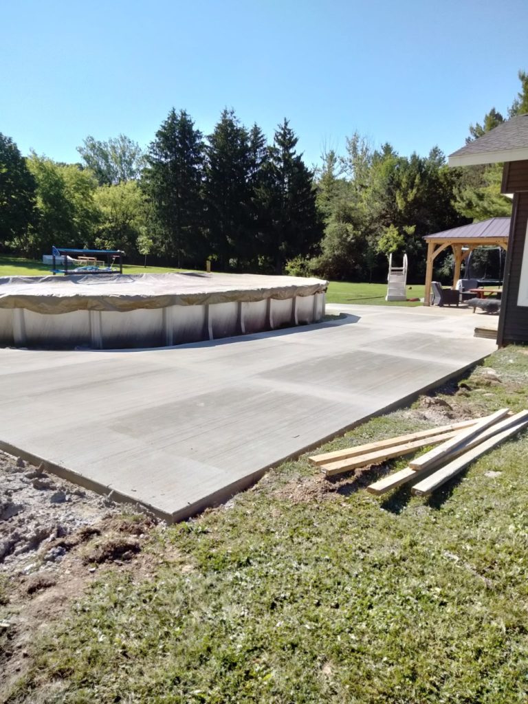 Finished concrete around a swimming pool.