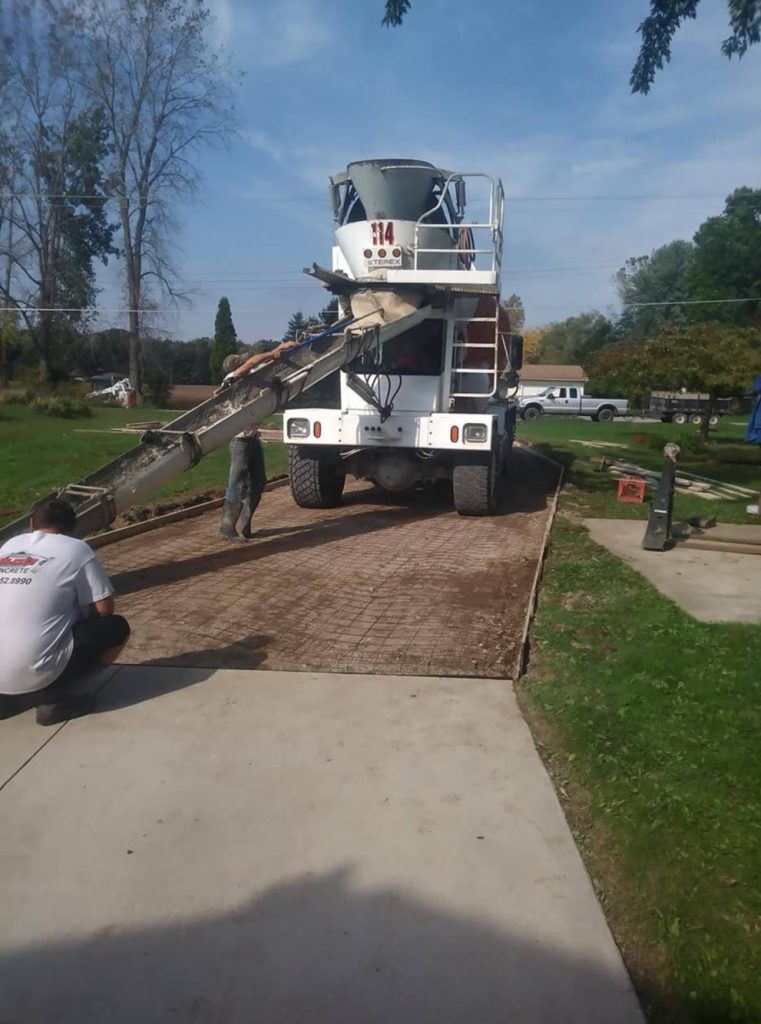 Pouring concrete from the truck.