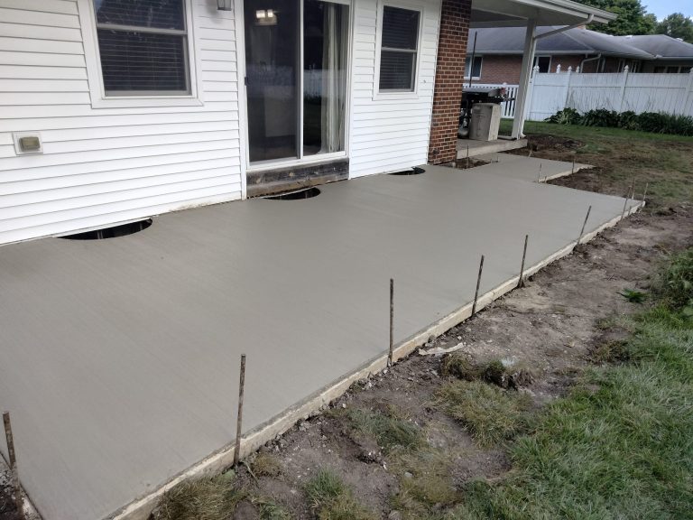 Picture of a home back patio with finished concrete.