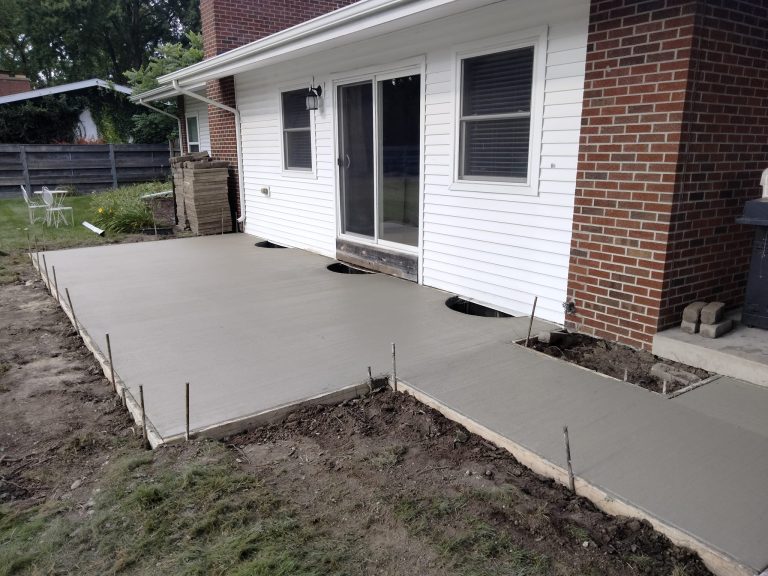 Picture of a home back patio with finished concrete.