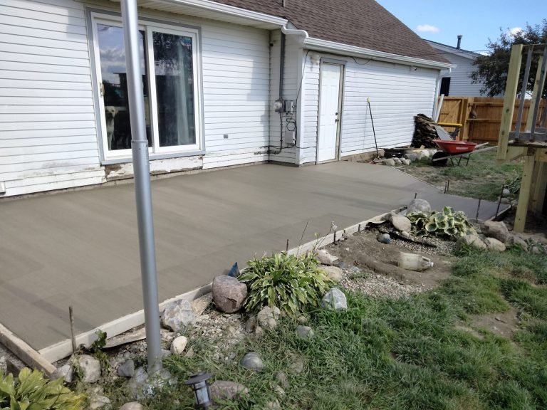 Picture of a home back patio with finished concrete.