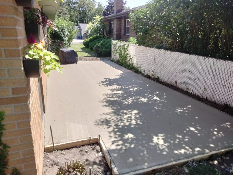 Picture of a home back patio with finished concrete.