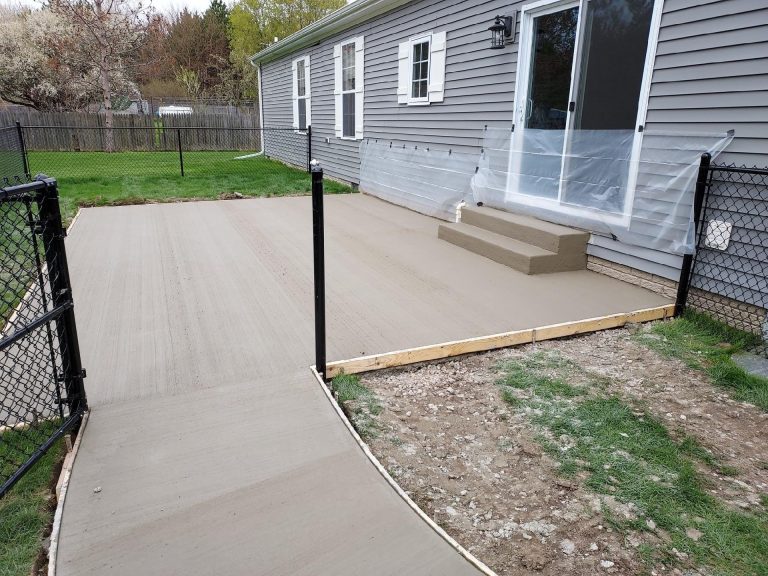 Picture of a home back patio with finished concrete.