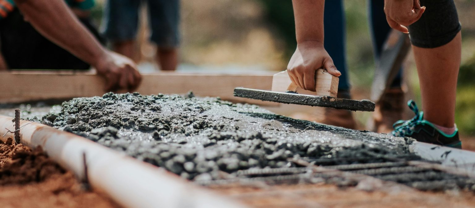 Spreading concrete.